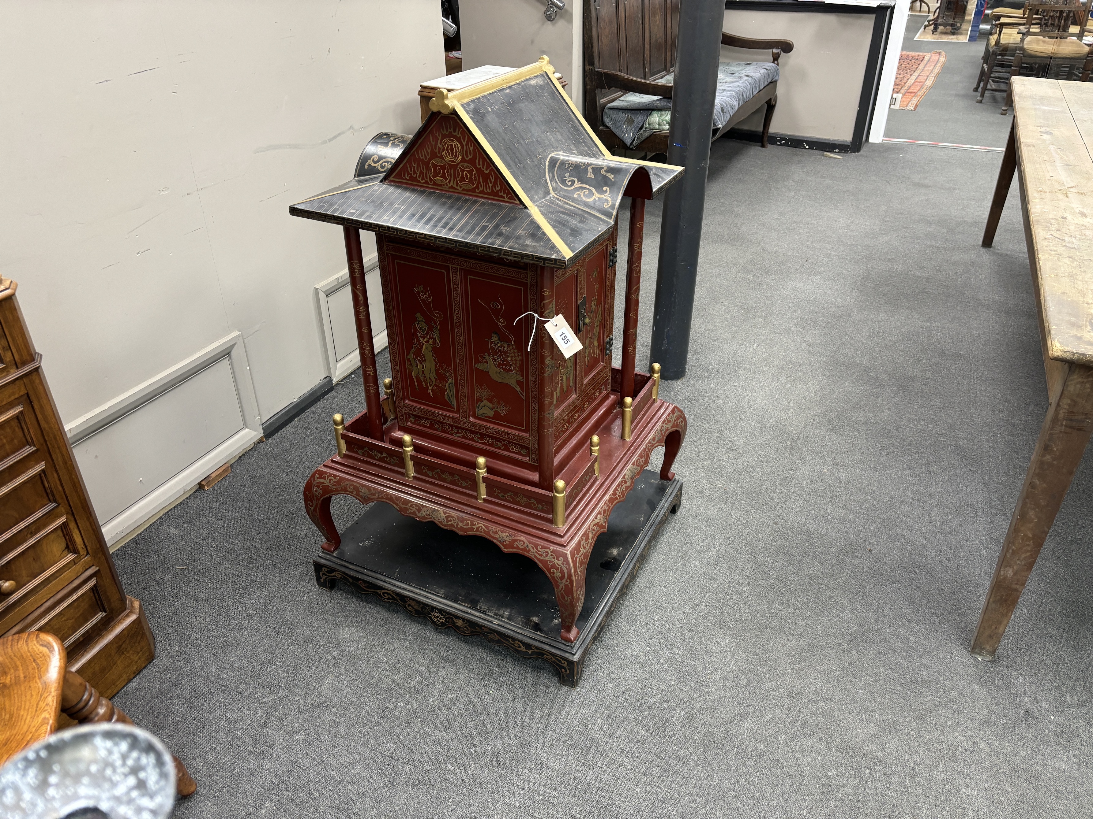 A Chinese scarlet and black lacquer temple shrine, height 112cm